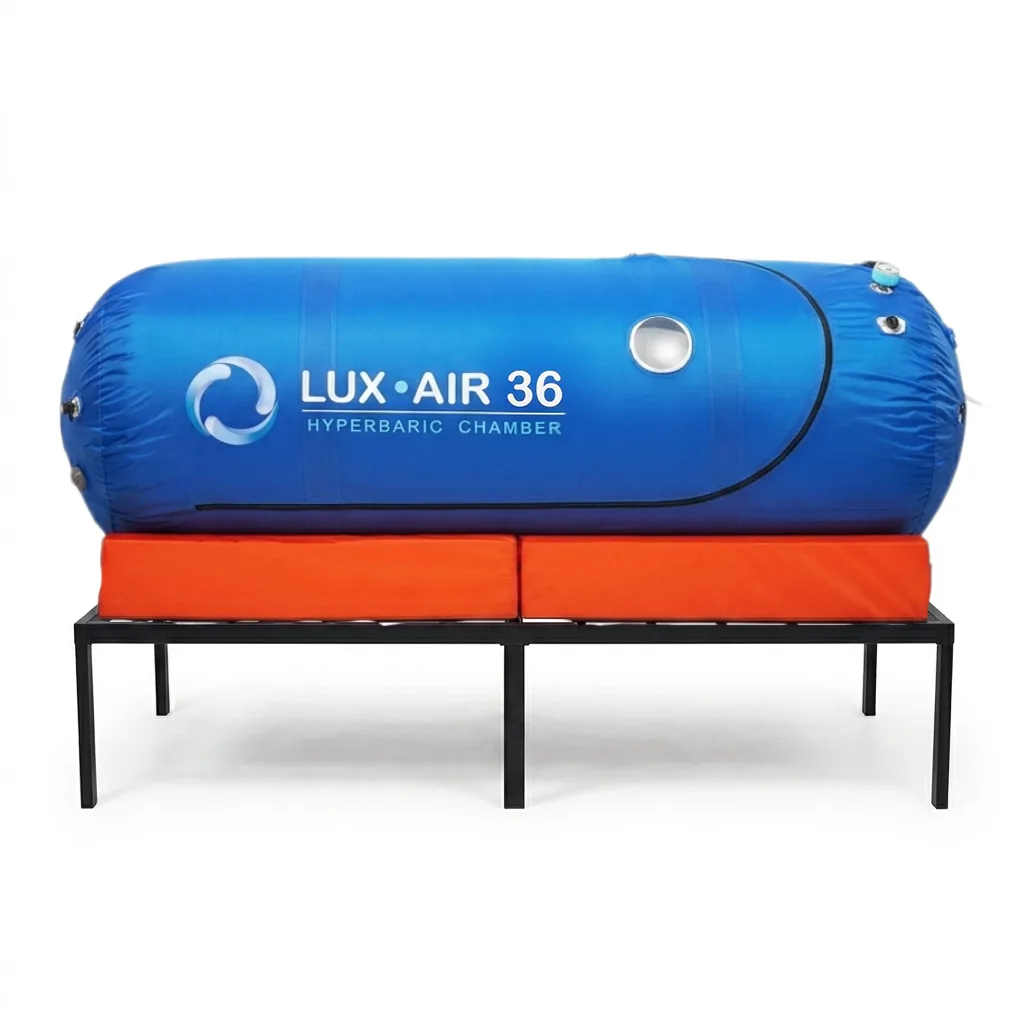 Blue Lux Air 36 soft hyperbaric chamber resting on an orange mattress and black metal stand
